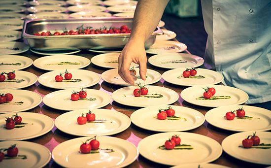 Plating up starters at a corporate function.